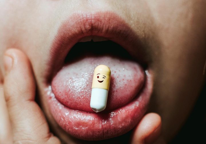 A psychiatric drug on the patient's tongue