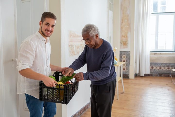 Helping an elderly person, delivering groceries at home